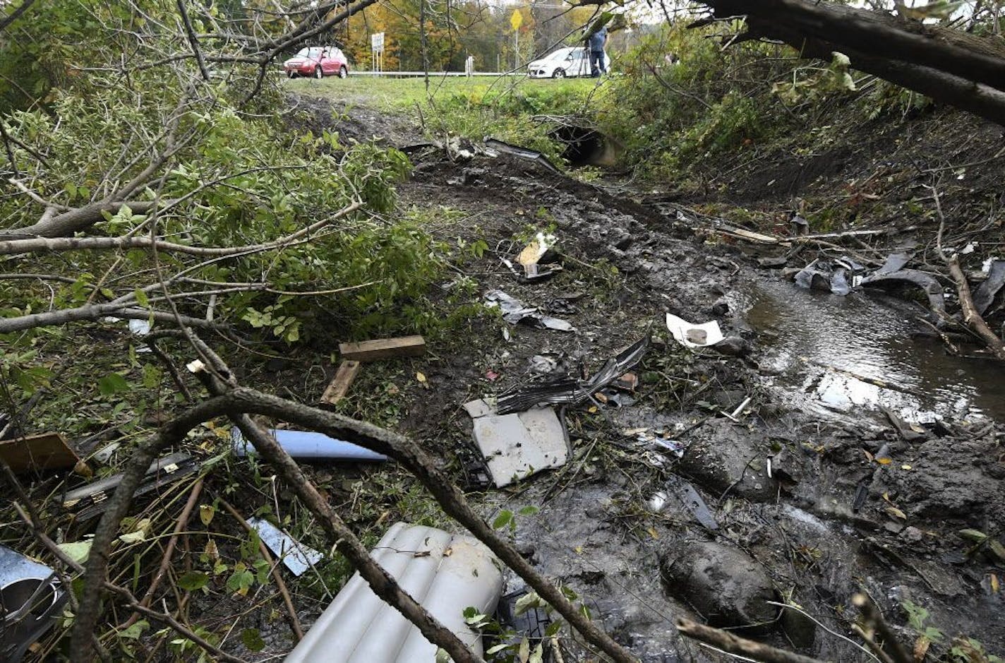 Debris was scattered in a wooded area Sunday, Oct. 7, 2018, at the site of Saturday's fatal crash in Schoharie, N.Y.