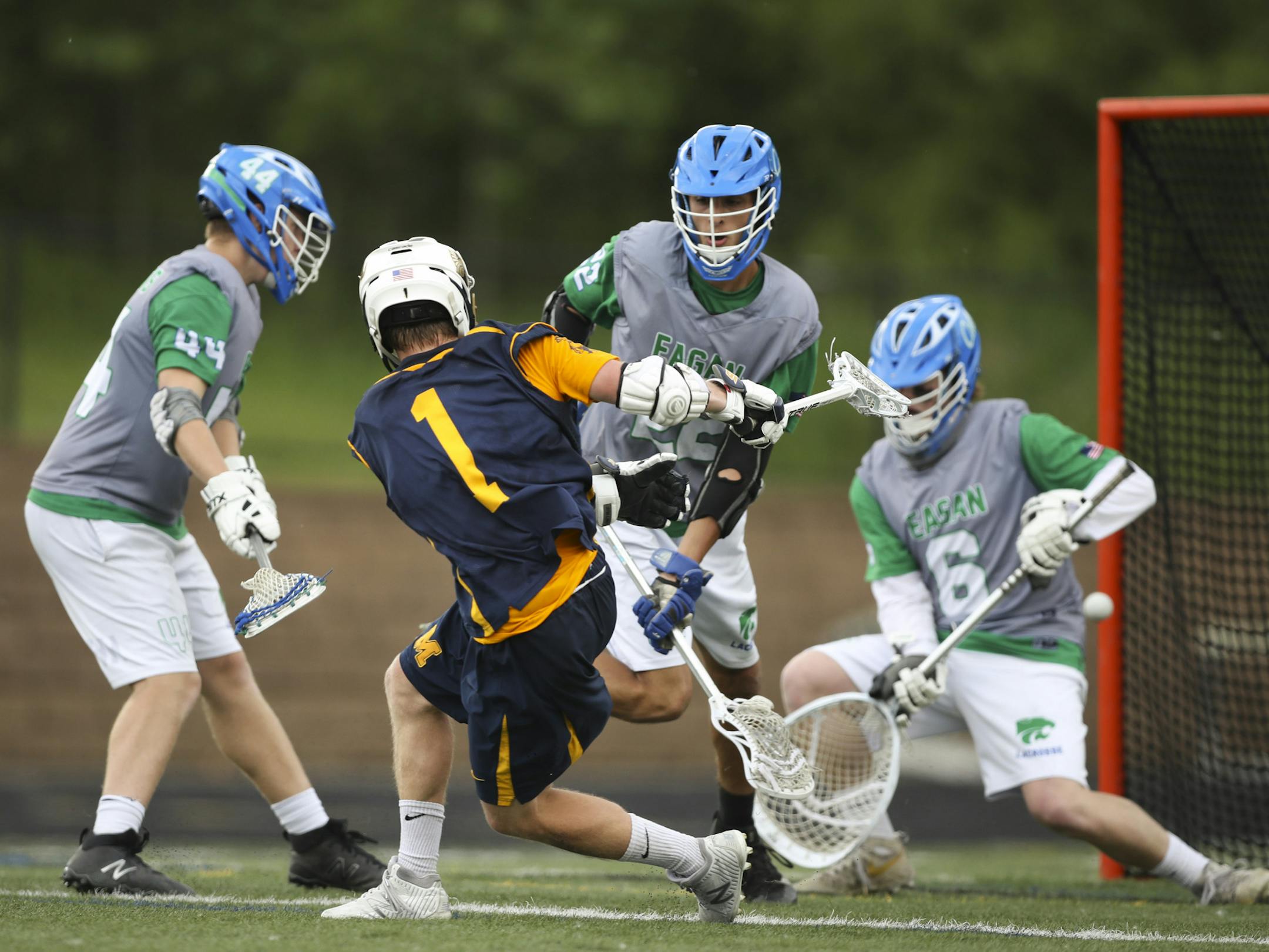 Mahtomedi's Josh Campbell scored on Eagan's Jack Courington in the second half despite the defensive effort of Joey Mills (22) and Andrew Kaul (44). ] JEFF WHEELER ï jeff.wheeler@startribune.com Mahtomedi beat Eagan 12 - 10 in their quarterfinal game of the Minnesota State High School League's boys' lacrosse tournament Tuesday afternoon, June 12, 2018 at Chanhassen High School.