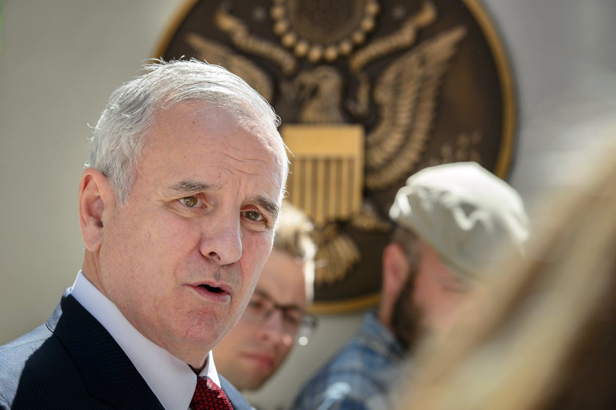 Gov. Mark Dayton talked with reporters as he left the meeting at the Federal Courthouse in St. Paul.