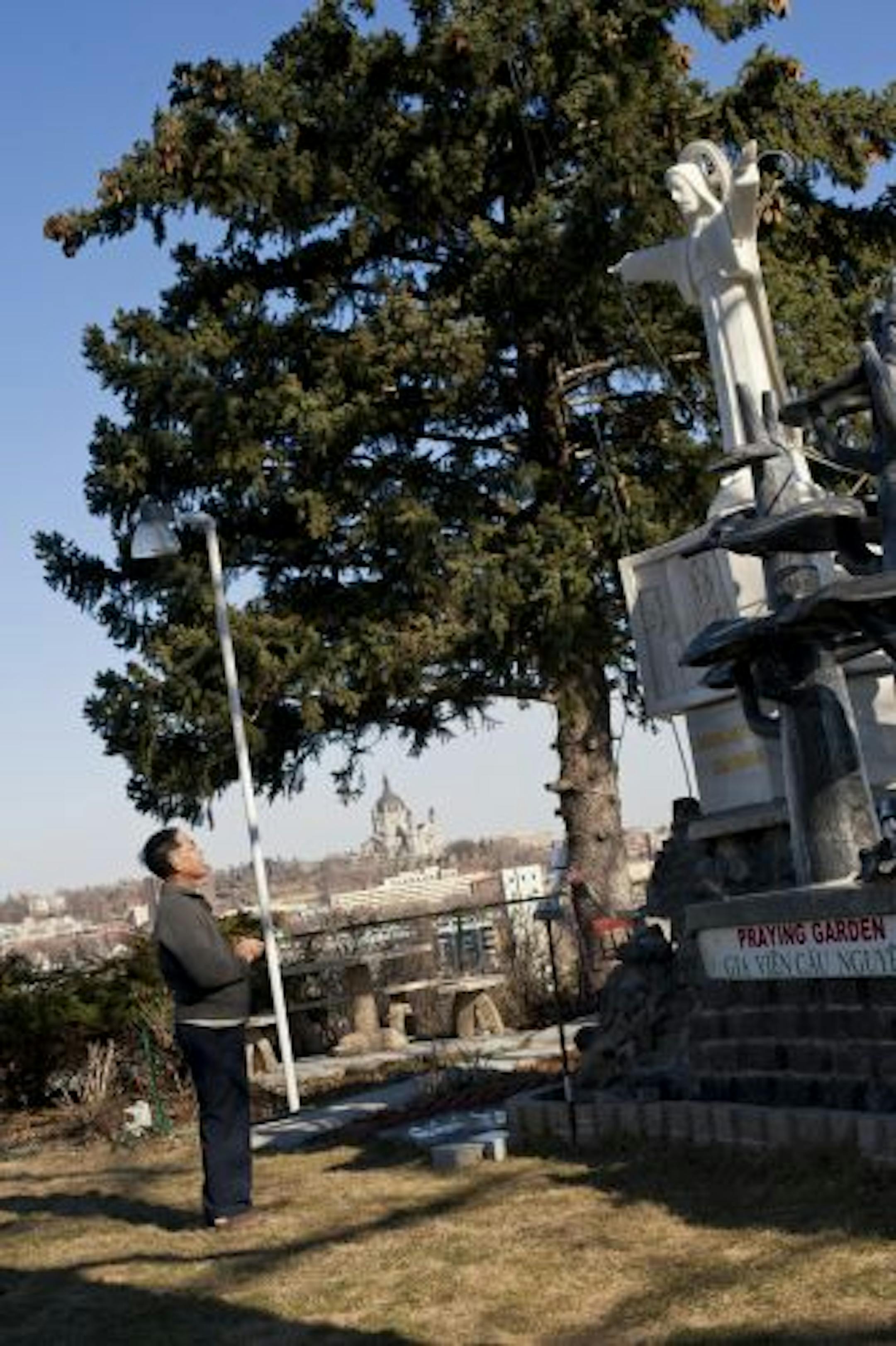 Pham's marble statue was carved in Vietnam and transported here. It is a replica of a 105-foot monument in Vietnam. He says his Catholic faith is extremely important to him and he bought his river-bluff house so he can see the Cathedral of St. Paul.