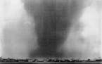 John Croft/Star Tribune file photo: A F4 tornado moves over Moore Lake heading straight for the Fridley Junior High School, Fridley, Minn., May 6, 196