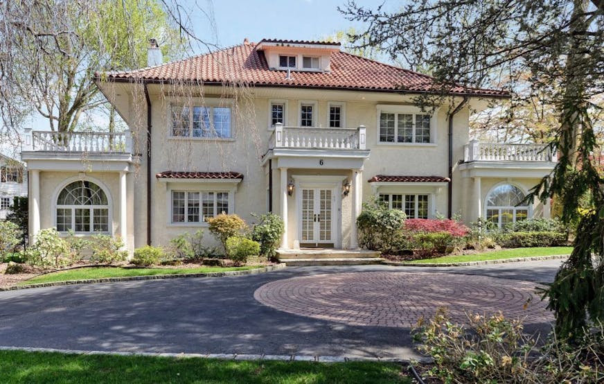 This undated photo provided by Coldwell Banker Residential Brokerage shows the home where F. Scott Fitzgerald lived in from 1922 through 1924 in the village of Great Neck Estates on Long Island just outside New York City. Fitzgerald is believed to have written "The Great Gatsby" while living in the home. A spokeswoman for Coldwell Banker Residential Brokerage said Wednesday, May 20, 2015, that the asking price for the manor home that's for sale is just over $3.8 million. She declined to identify