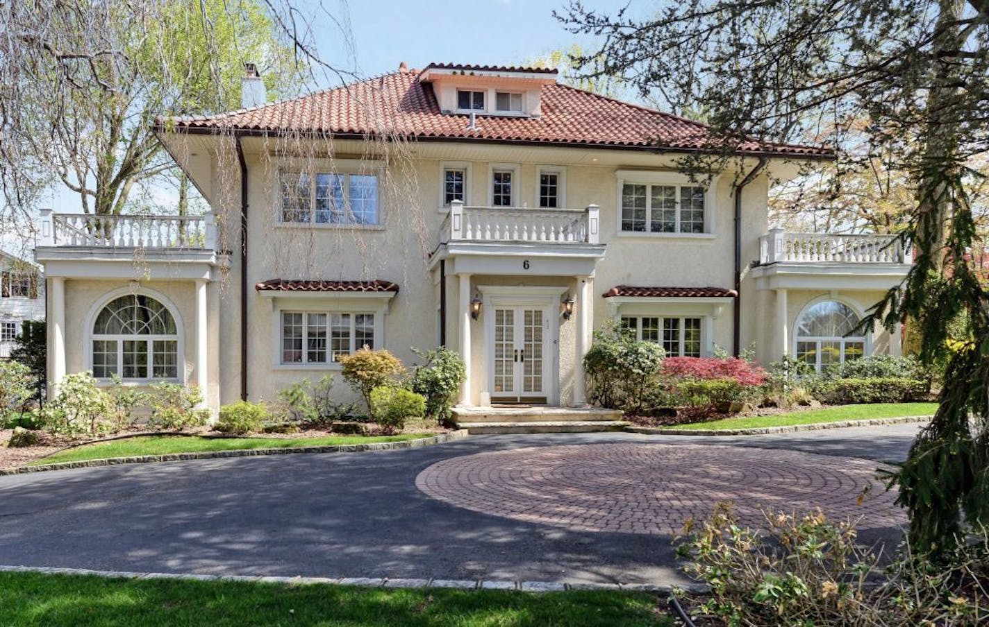 This undated photo provided by Coldwell Banker Residential Brokerage shows the home where F. Scott Fitzgerald lived in from 1922 through 1924 in the village of Great Neck Estates on Long Island just outside New York City. Fitzgerald is believed to have written "The Great Gatsby" while living in the home. A spokeswoman for Coldwell Banker Residential Brokerage said Wednesday, May 20, 2015, that the asking price for the manor home that's for sale is just over $3.8 million. She declined to identify
