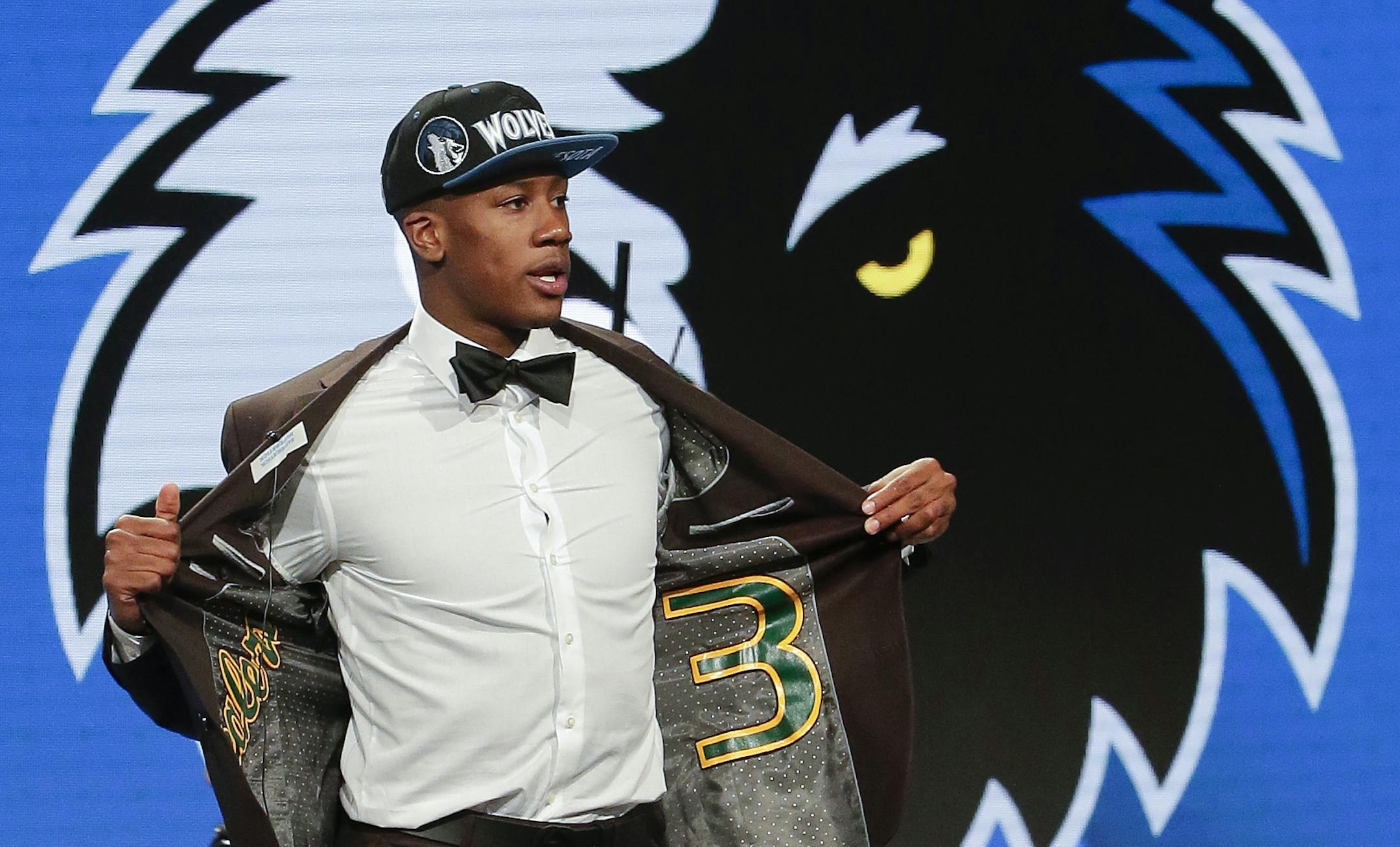 Kris Dunn reacts as he steps up on stage after being selected fifth overall by the Minnesota Timberwolves during the NBA basketball draft, Thursday, June 23, 2016, in New York. (AP Photo/Frank Franklin II)