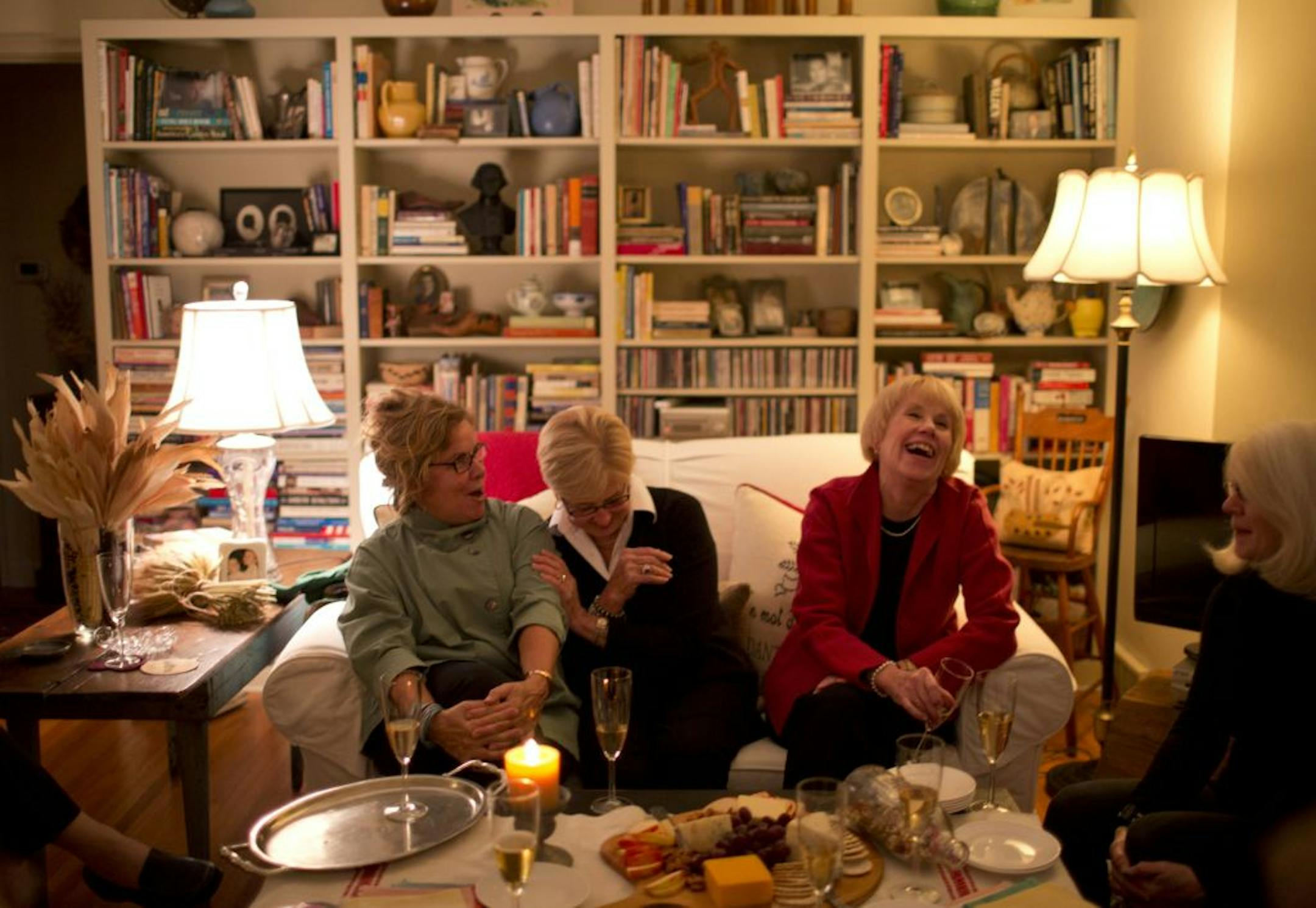 Denise Remak, left, had October's gourmet group get-together at her house. Par for the course, tales were told - and enjoyed. Remak, Sandi Martin, center, and Judy Johnson cracked up at the telling of a story about one of their gatherings years ago.