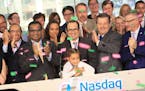 Federico Tripodi (center) CEO of New Brighton-based ag-tech company Calyxt, his daughter Mia, and other officials from Calyxt rang the Opening Bell on