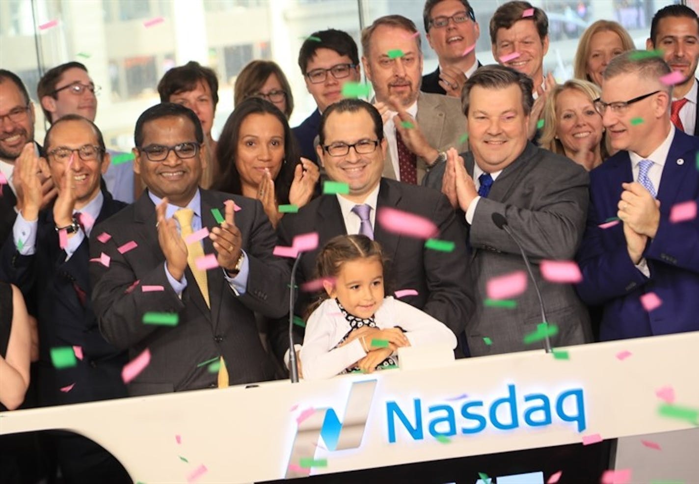 Federico Tripodi (center) CEO of New Brighton-based ag-tech company Calyxt, his daughter Mia, and other officials from Calyxt rang the Opening Bell on Nasdaq to commemorate Calyxt's initial public offering.