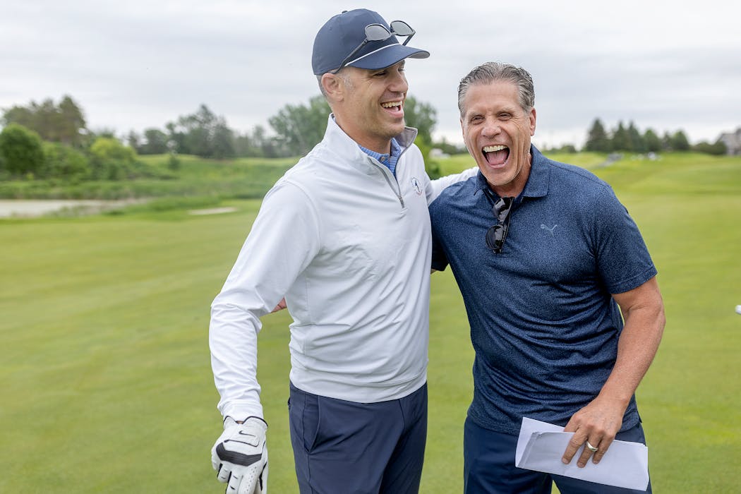 KARE 11's retiring anchor Randy Shaver, right, shares a laugh with Twins legend Joe Mauer at the Rush Creek Country Club in Maple Grove.