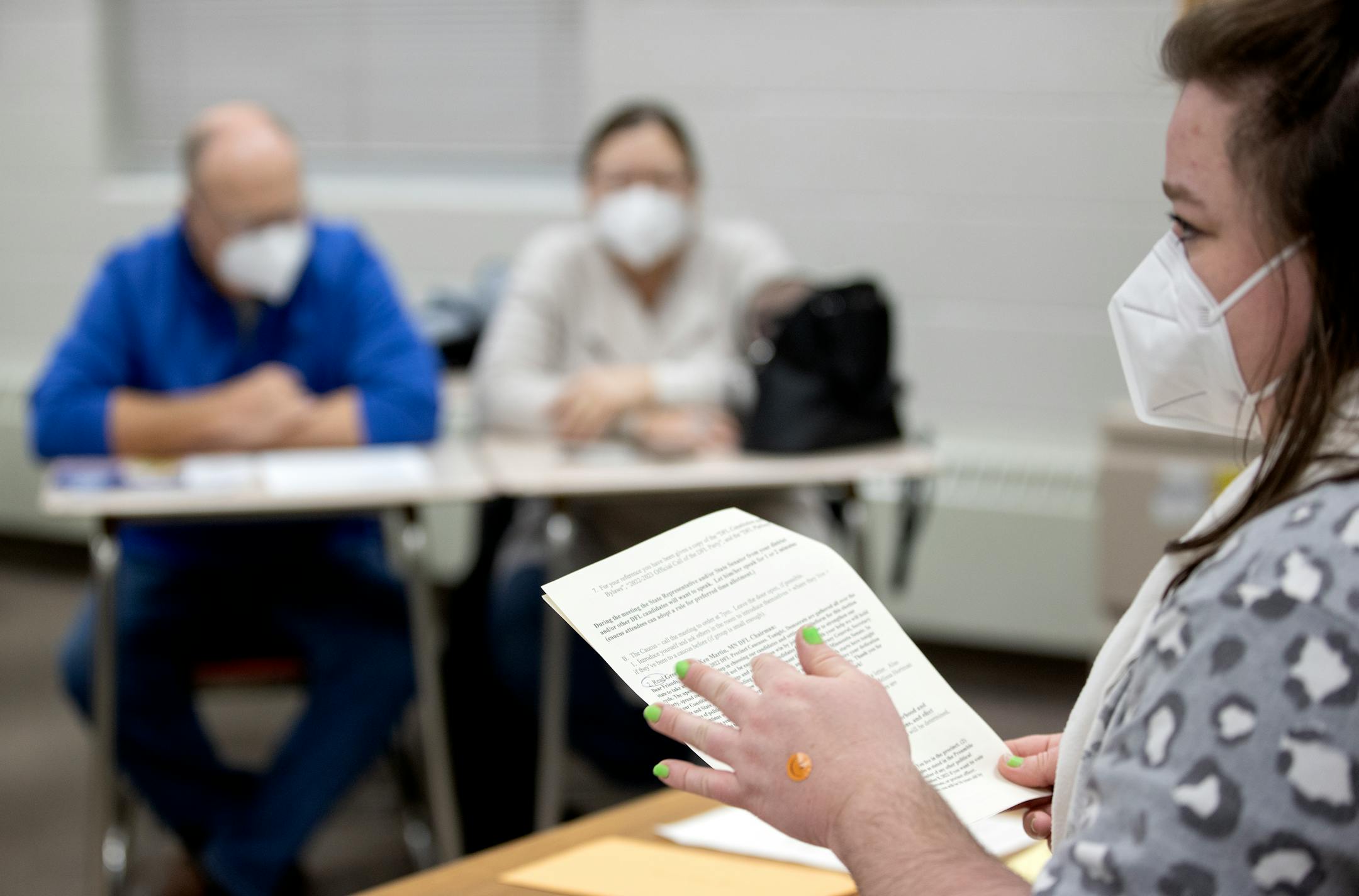North St. Paul precinct 1 chair Beth Jensen reads the agenda during a DFL caucus Tuesday, Feb. 1, at North High School in North Saint Paul, Minn. ] CARLOS GONZALEZ • cgonzalez@startribune.com