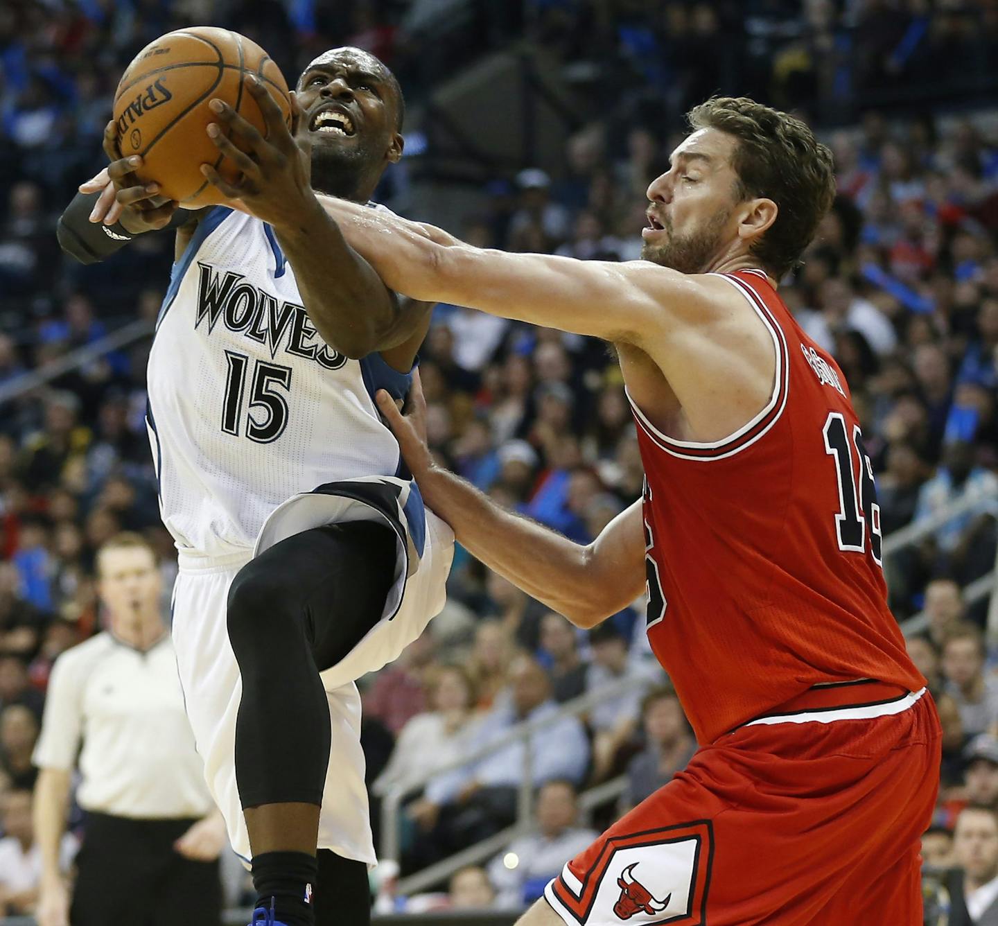 Minnesota Timberwolves' Shabazz Muhammad, left, goes up for two against Chicago Bulls' Pau Gasol (16) during the first half of an NBA preseason basketball game, Saturday, Oct. 10, 2015 in Winnipeg, Manitoba. (John Woods/The Canadian Press via AP) MANDATORY CREDIT ORG XMIT: MIN2015102218061682