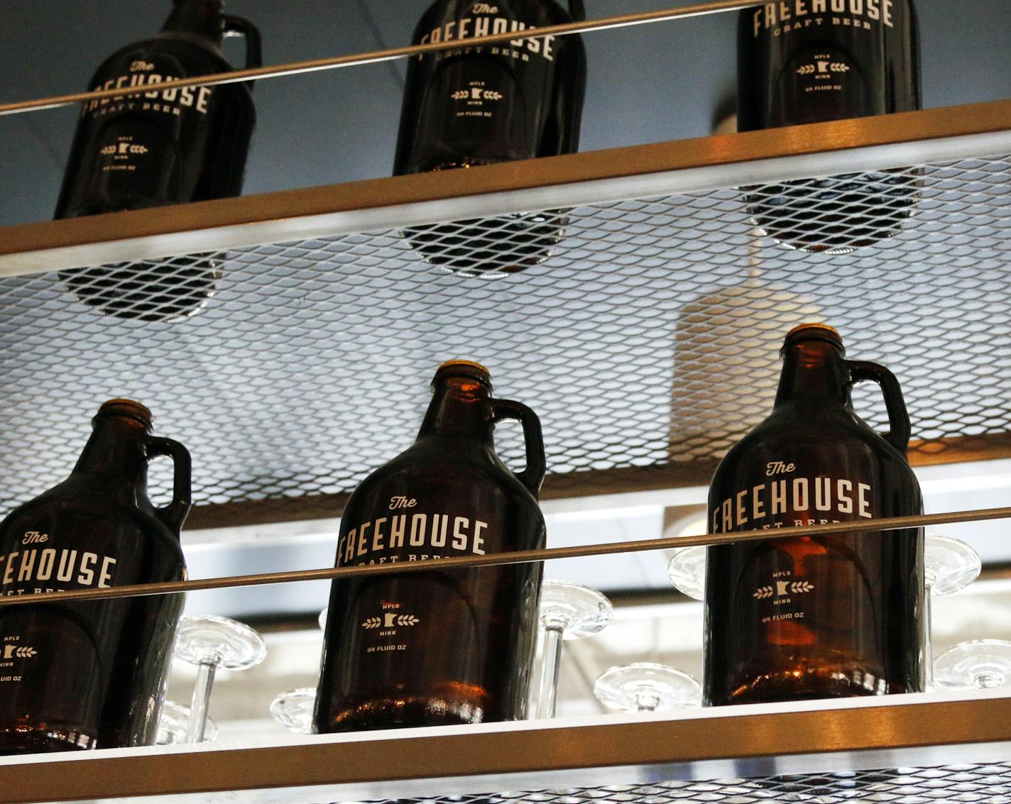 Growlers line the shelf above the bar. ] Restaurant review: Freehouse, the North Loop brewpub by the Blue Plate Restaurant Co. BRIAN PETERSON &#xef; brian.peterson@startribune.com Minneapolis, MN 3/28/2014 ORG XMIT: MIN1403281633540431