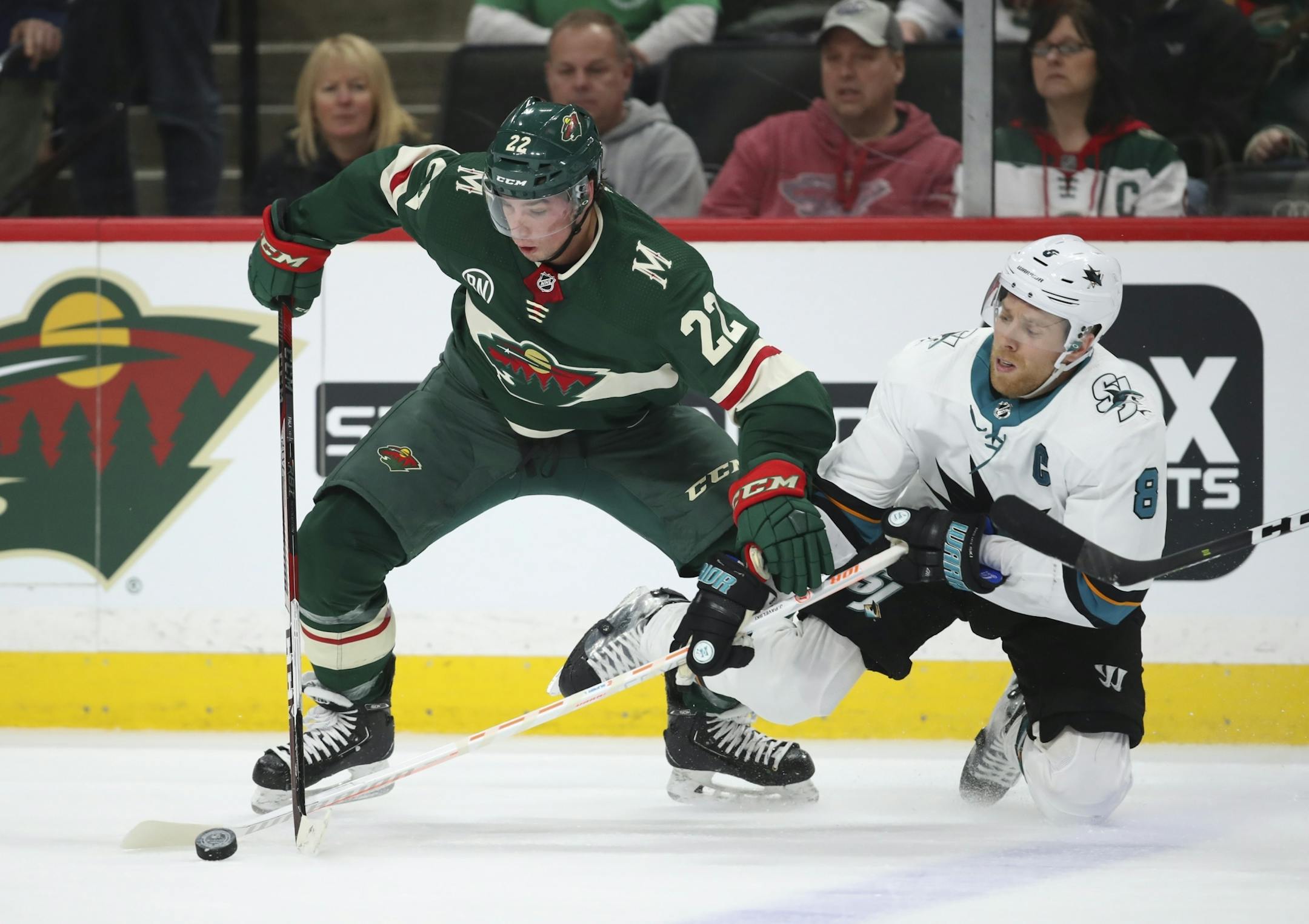 Minnesota Wild left wing Kevin Fiala (22) took the puck away from San Jose Sharks center Joe Pavelski (8) in the second period.