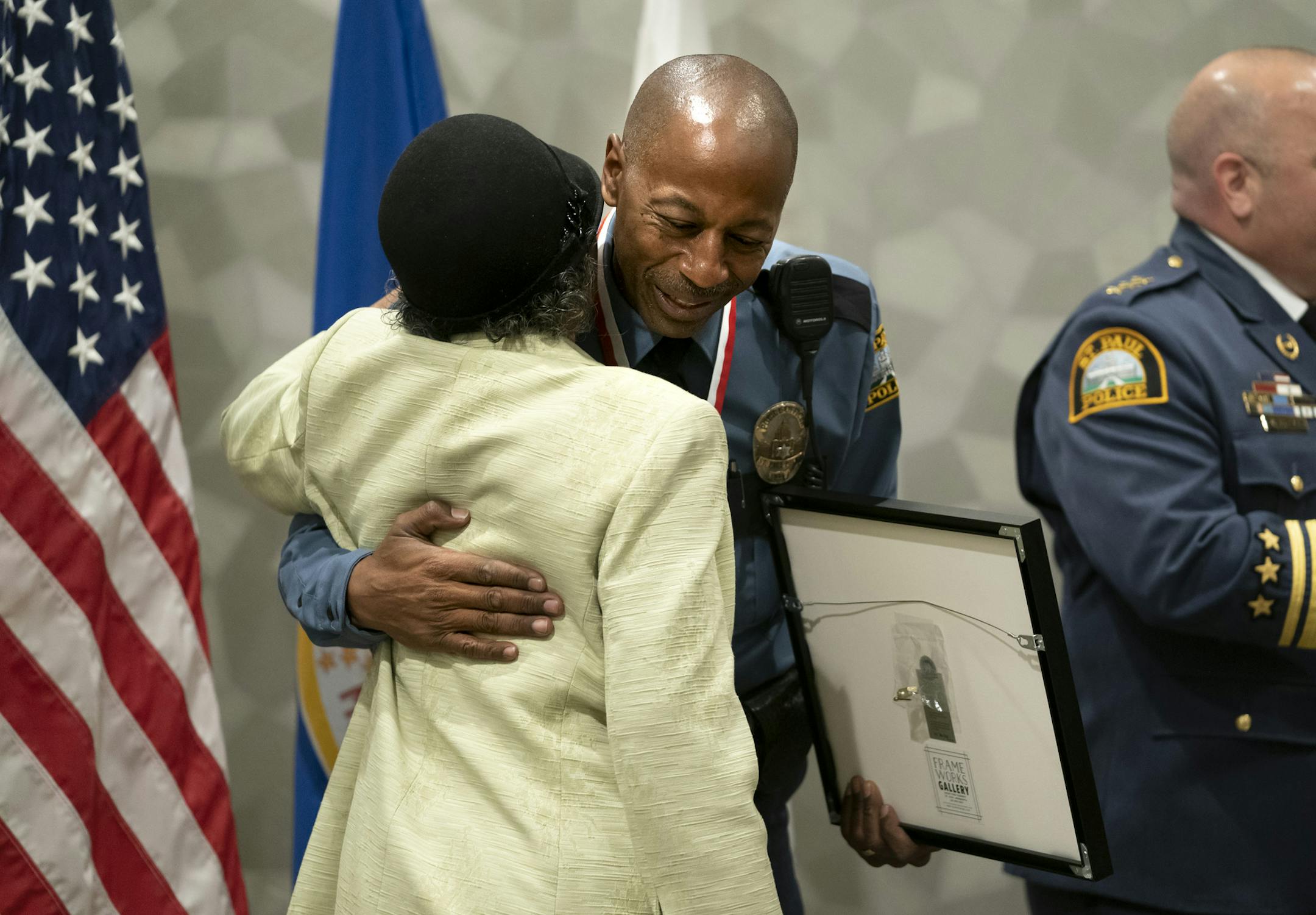 Officer Adrian Saffold hugged his mother Janie Saffold after he was honored with St. Paul Officer of the Year at a ceremony in St. Paul, Minn., on Monday, April 22, 2019. ] RENEE JONES SCHNEIDER ¥ renee.jones@startribune.com