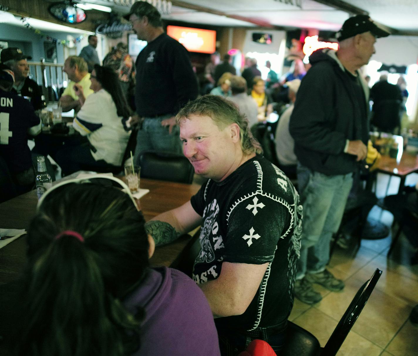 At BJ's Bar and Grill and Thielman in Wabasha County, more than a dozen ATV's were lined up on a Sunday afternoon during a Vikings' game. Owner Mark Jensen , black shirt, credits these clients for a significant portion of his business.] Richard Tsong-Taatarii/rtsong- taatarii@startribune.com