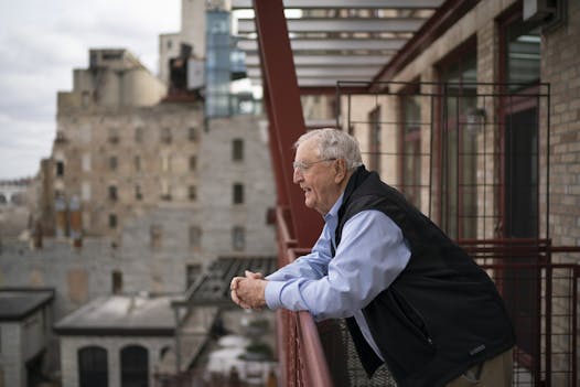 Former Vice President Walter Mondale on the balcony of his Mill District condo, which is a short drive from his office at Dorsey & Whitney.