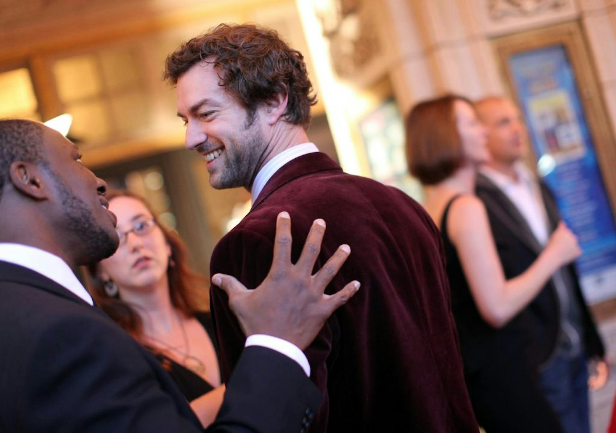 Actors Peter Christian Hansen, right, and Ansa Akyea chatted before the Ivey Awards at the Historic State Theatre in Minneapolis on Monday night. Hansen won for his performance in "Burn This."