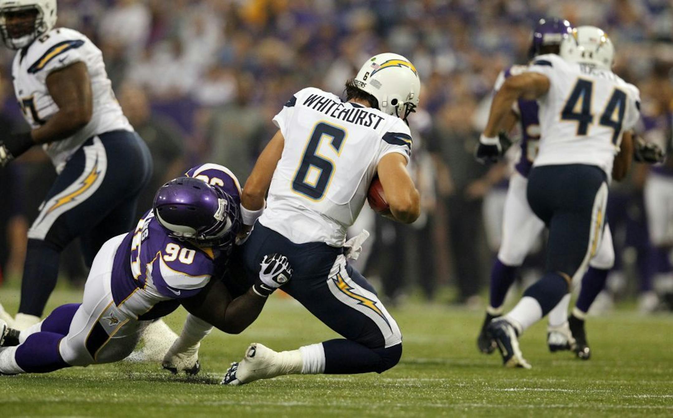 Vikings defensive tackle Fred Evans sacked quarterback Charlie Whitehurst in the first quarter of a preseason game against the San Diego Chargers at Mall of America Field.