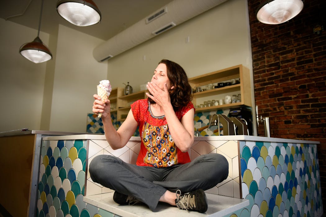 Love Creamery owner Nicole Wilde takes an ice cream break at her shop in Duluth’s Lincoln Park neighborhood.