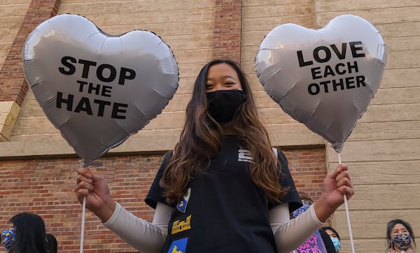 FILE - In this March 13, 2021, file photo, Chinese-Japanese American student Kara Chu, 18, holds a pair of heart balloons decorated by herself for the