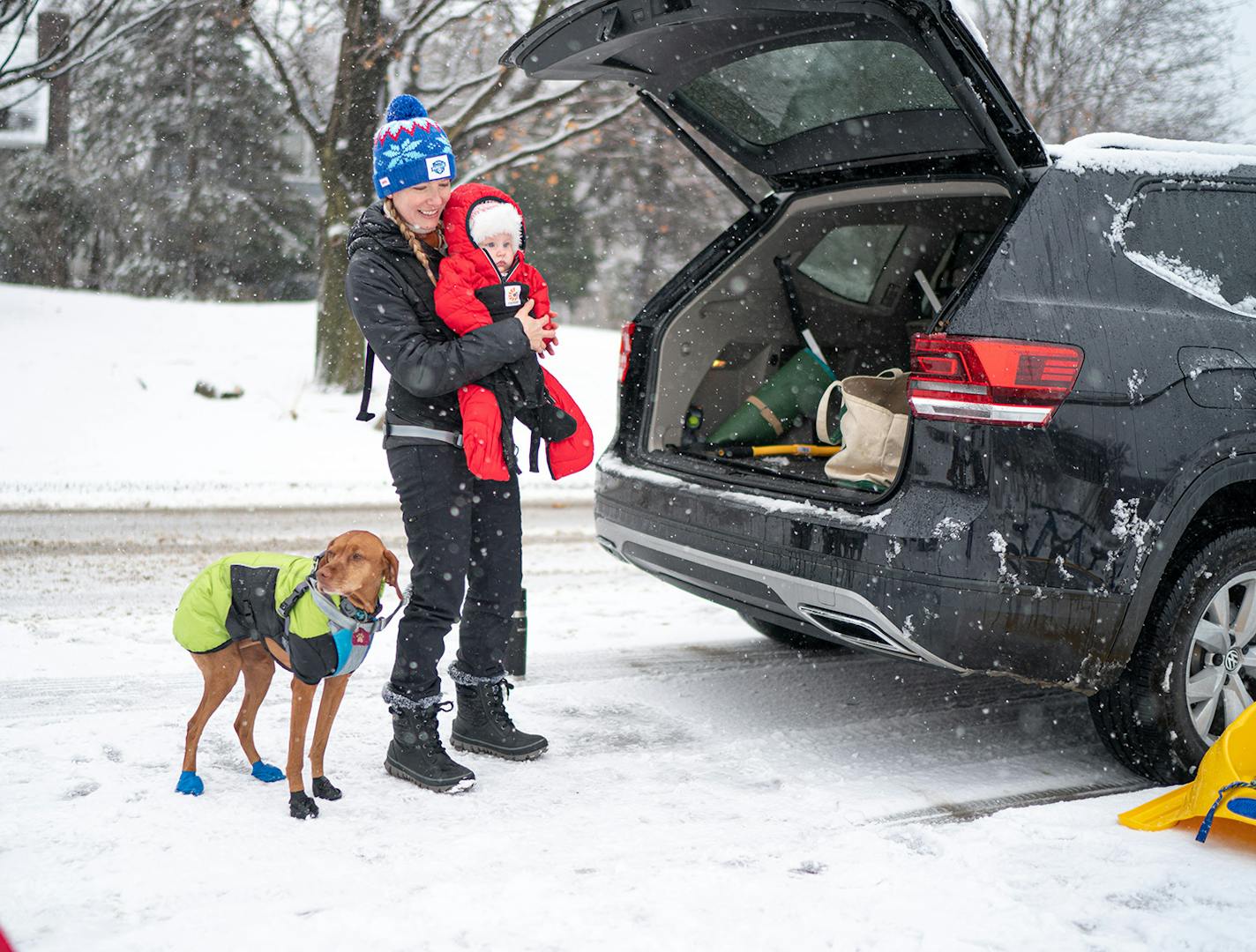 Mackenzie Havey, husband Jason and their kids Liesl, 3, and Liv, 5 months, along with their Vizsla, Welly, got ready for some winter fun in Arden Park in Edina.