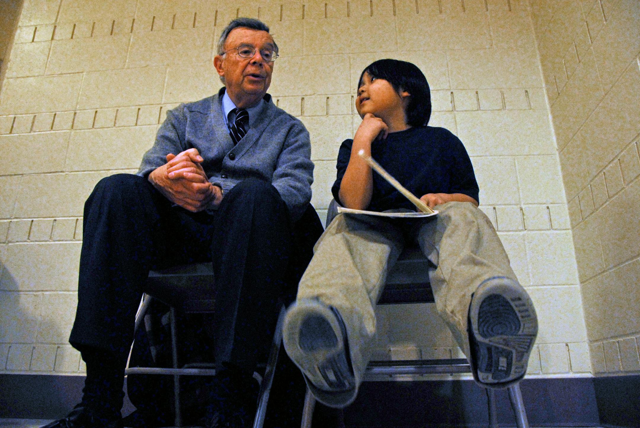 Judge Allen Oleisky talked with City View School second-grader Sean Ly about "No Roses for Harry," a book that Sean was about to read to Oleisky. The judge will retire at the end of the month, but he said he will keep reading with Sean.