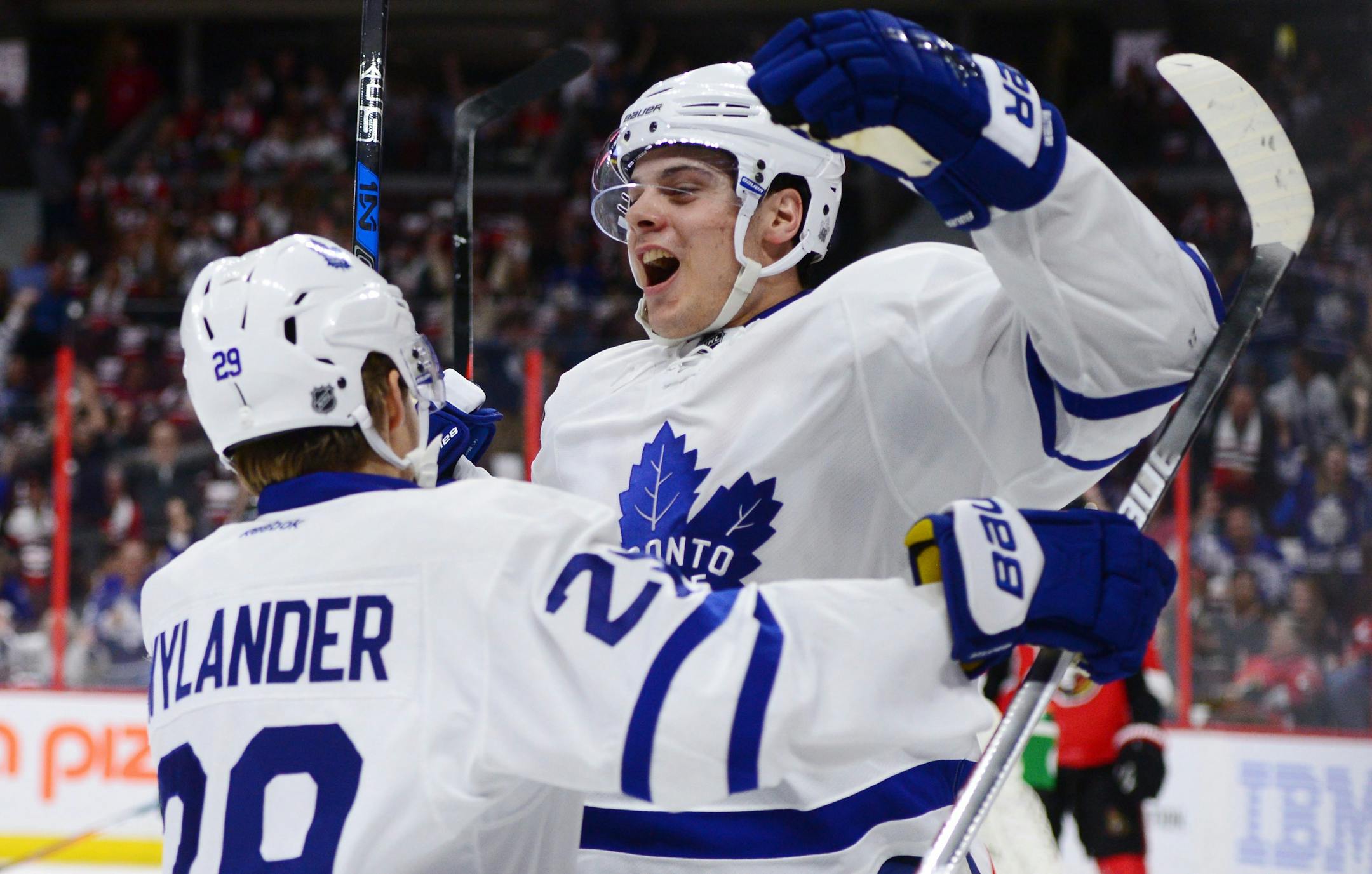 Toronto Maple Leafs center Auston Matthews, right, celebrates a first period goal against the Ottawa Senators with teammate William Nylander during an NHL hockey game Wednesday, Oct. 12, 2016, in Ottawa, Ontario. (Sean Kilpatrick/The Canadian Press via AP)
