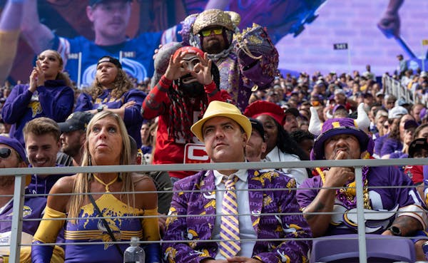 The football gods (unseen), and Bucs fans (seen), hovered menacingly around Vikings fans Danielle Zanoth and Jon Cook in the opener.