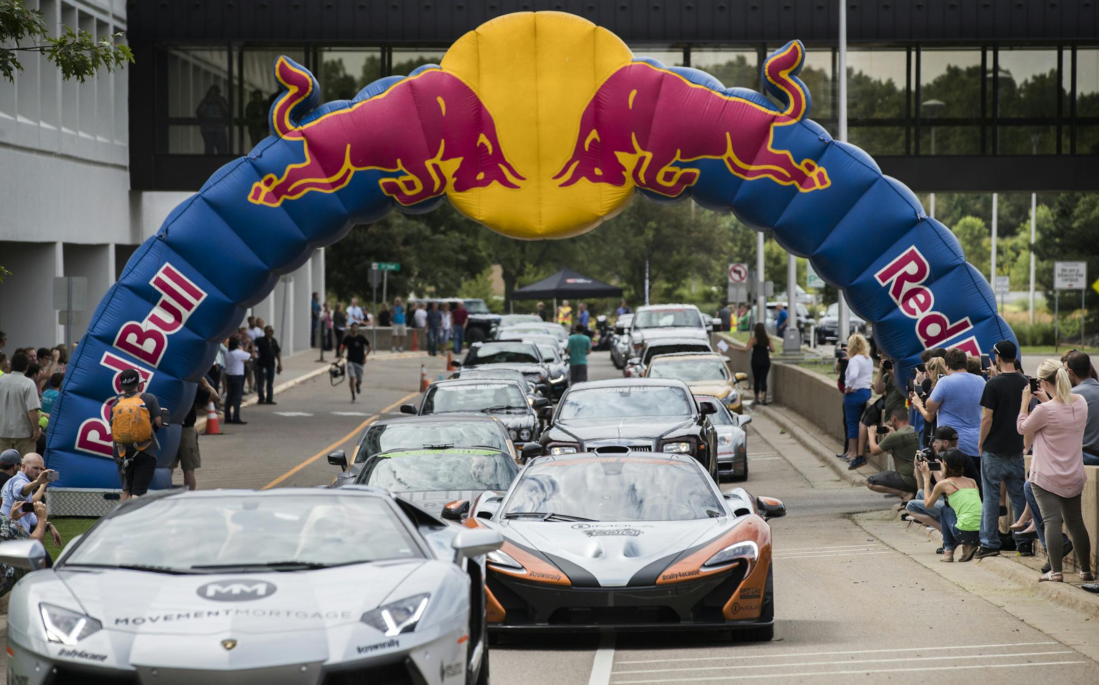 Cars begin the rally at 3M headquarters. ] (Leila Navidi/Star Tribune) leila.navidi@startribune.com BACKGROUND INFORMATION: The third annual Crown Rally, an automotive event benefitting The Epilepsy Foundation, leaves from the 3M headquarters in Maplewood on it's way to Chicago on Friday, August 12, 2016.
