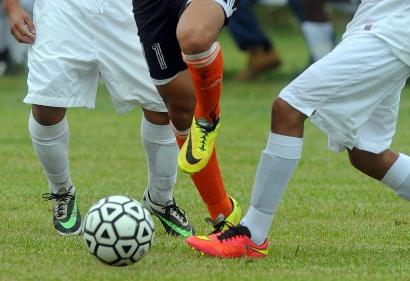 FILE - In this Wednesday, Sept. 24, 2014 file photo, students compete in a high school soccer game in Burgaw, N.C. A study released on Monday, Sept. 11, 2016 found soccer injuries are sending increasing numbers of U.S. youth to emergency rooms, a trend driven partly by young players with concussions seeking urgent medical care. The findings, based on 25 years of data, partly reflect soccer's growing popularity.