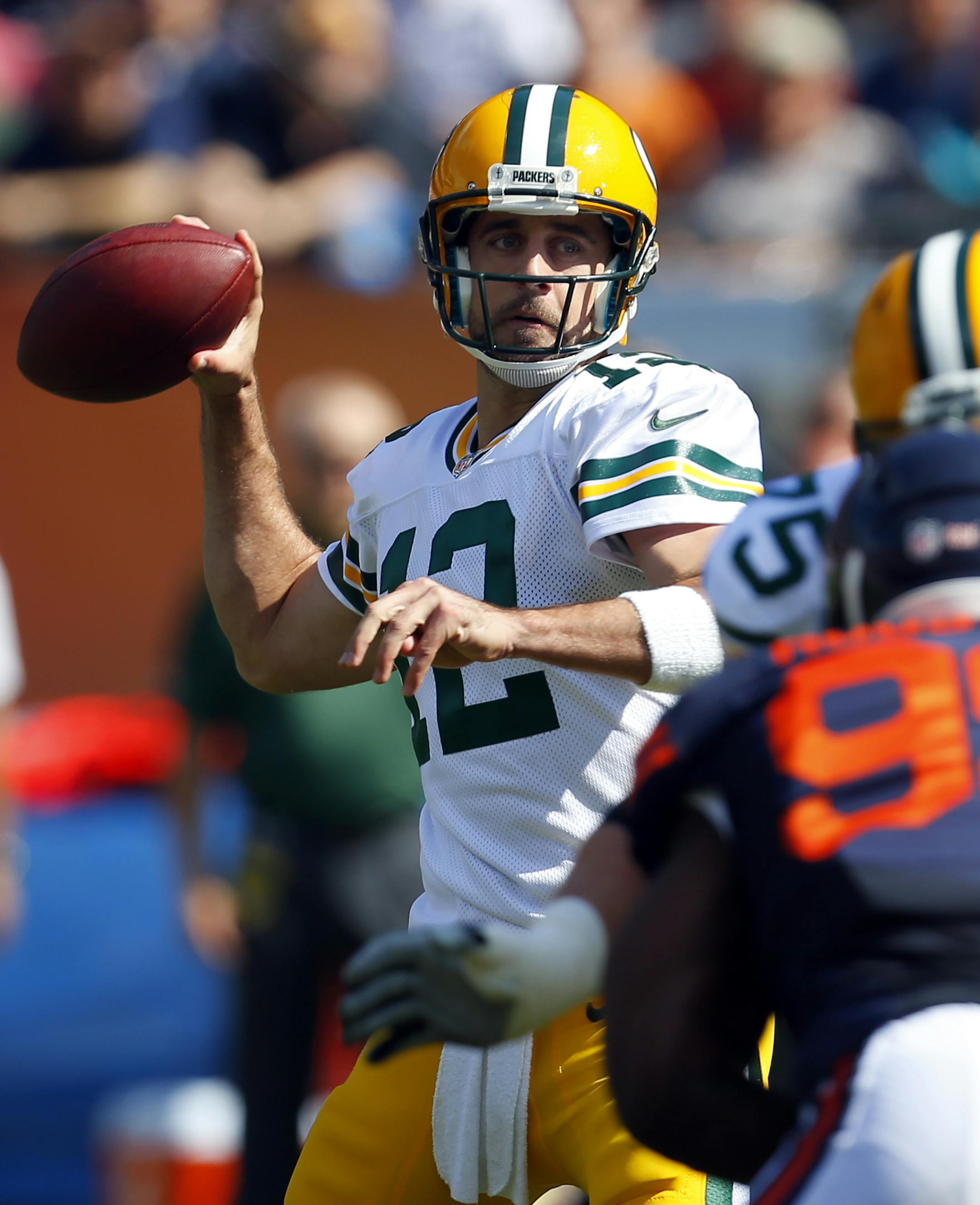 Green Bay Packers quarterback Aaron Rodgers (12) looks to pass against the Chicago Bears during an NFL game at Soldier Field in Chicago on Sunday, Sept. 28, 2014. (Jeff Haynes/AP Images for Panini)
