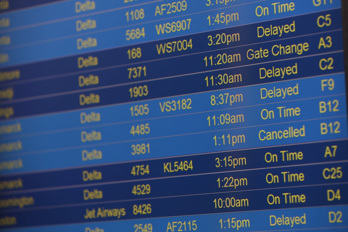 Video boards displaying flight information showed delayed and canceled flights mostly due to weather Monday at Minneapolis-St. Paul International Airport.