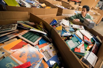 Marla Butler of Plymouth sorted books at Books for Africa in St. Paul.