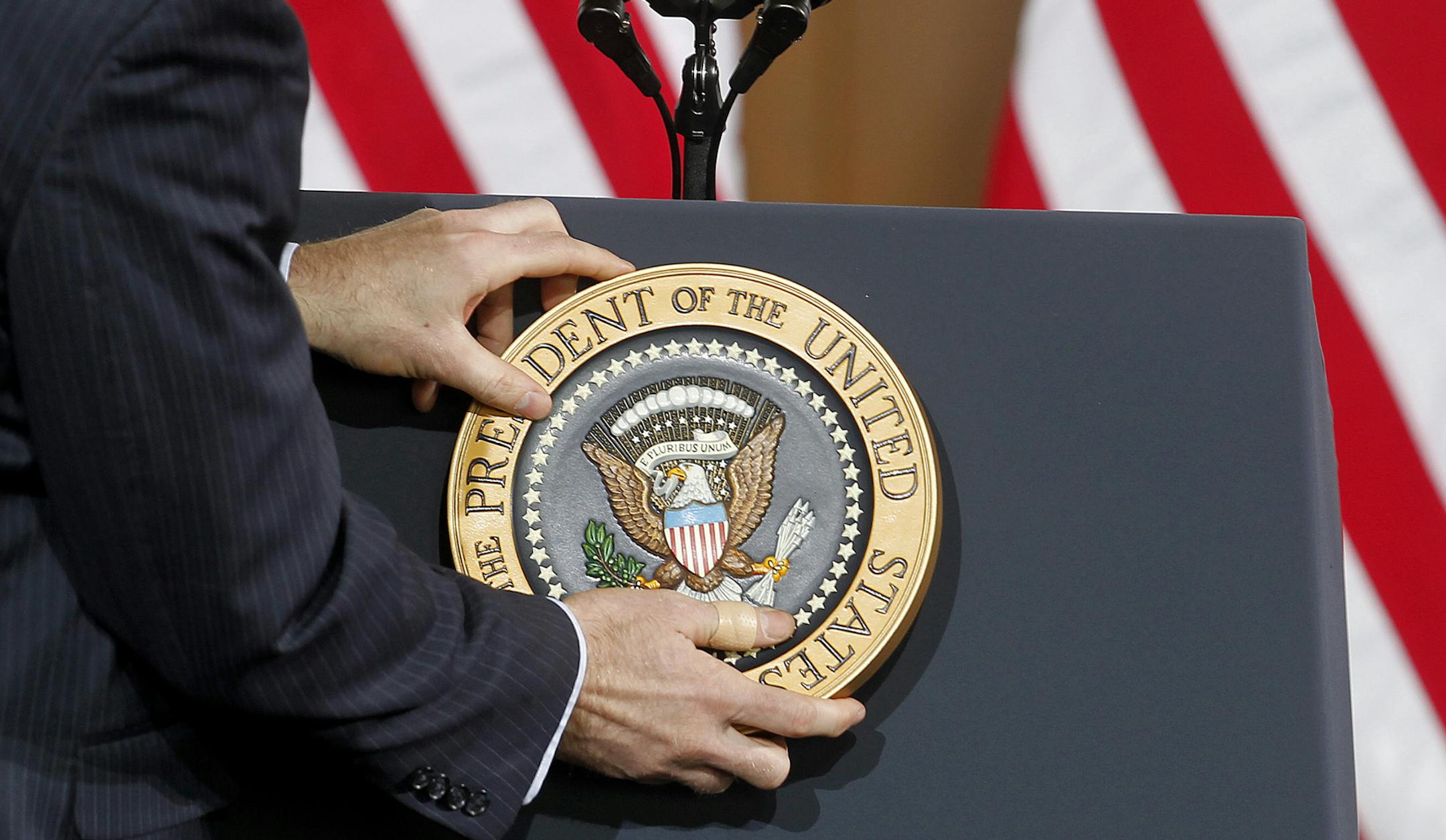 President Barack Obama presidential emblem was placed on the podium before he spoke to a crowd at the Union Depot, Wednesday, February 26, 2014 in St. Paul, MN. (ELIZABETH FLORES/STAR TRIBUNE) ELIZABETH FLORES &#x2022; eflores@startribune.com ORG XMIT: MIN1402261542180153