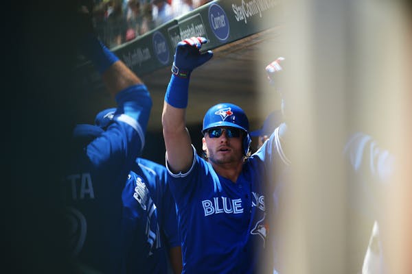 Blue Jays infielder Josh Donaldson celebrated after hitting a home run in the first inning of Toronto's 3-1 victory over the Twins at Target Field on 