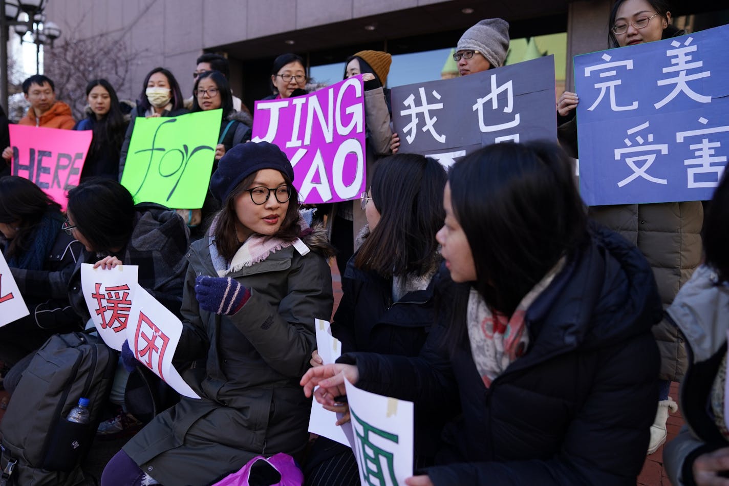 Supporters of Liu Jingyao, a student at the University of Minnesota, who accused Chinese billionaire Richard Liu of rape, gathered in front of the Hennepin County Government Center to take photos for Chinese social media and rally on her behalf.