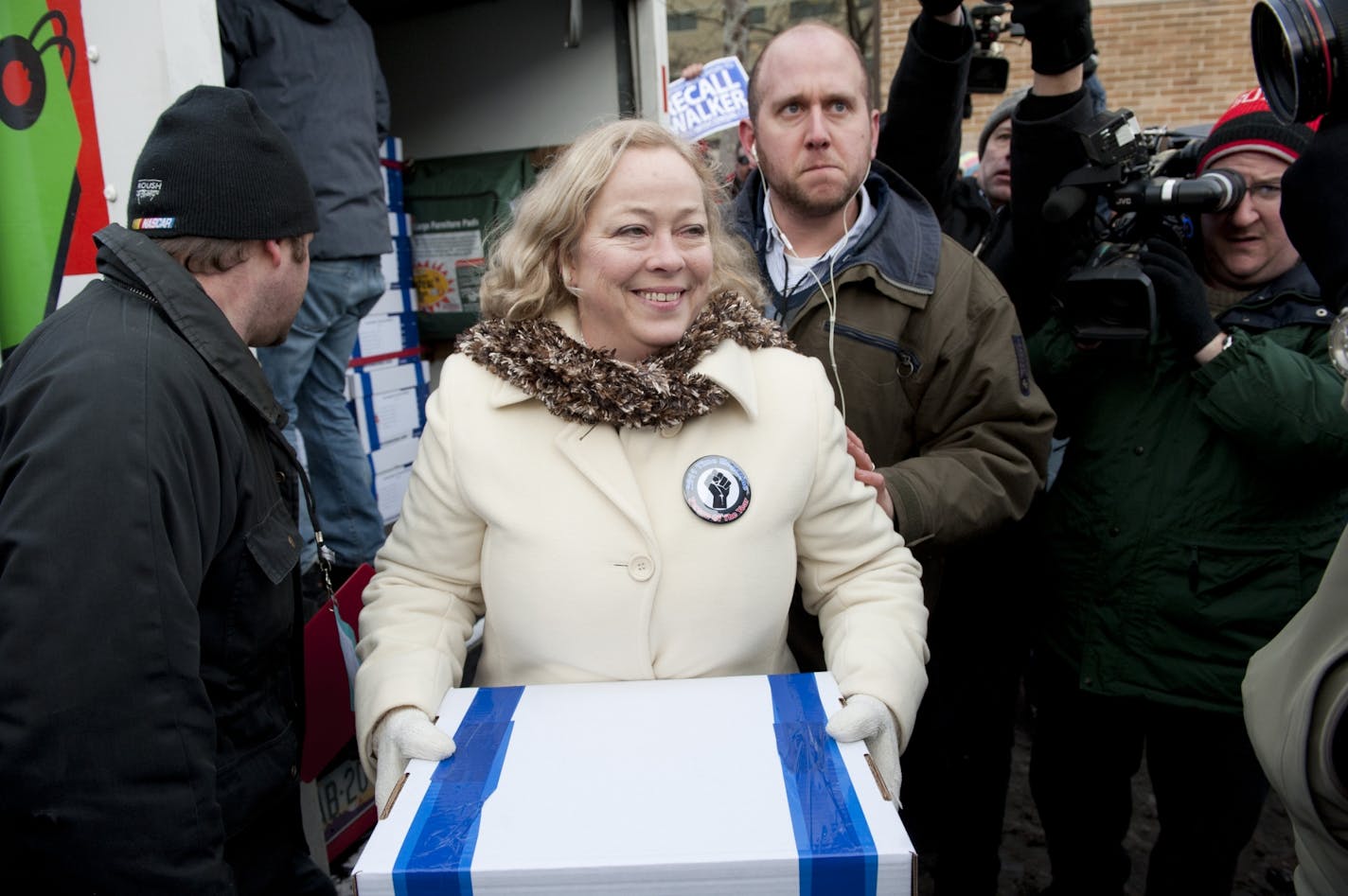 Julie Wells, of United Wisconsin, the Jefferson County grandmother and factory worker who triggered the recall, carried the first box of recall signatures to Wisconsin's Government Accountability Board.