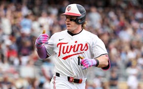 The Twins' Harrison Bader celebrates his home run Saturday, a day after he took care not to reinjure shortstop Carlos Correa.