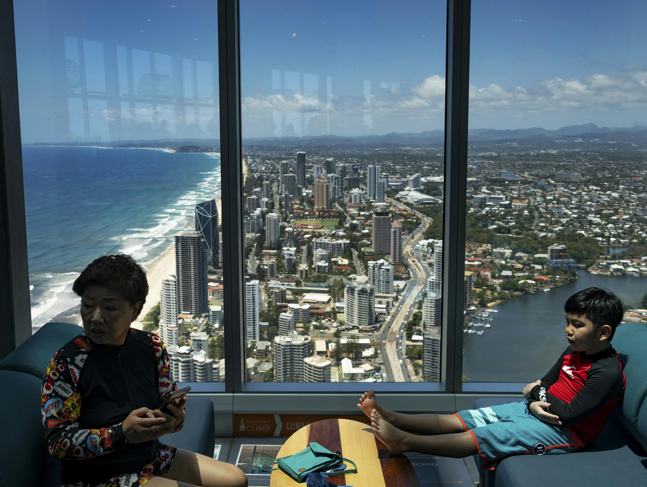 Chinese tourists at the SkyPoint Observation Deck in the Gold Coast, Australia, Jan. 15, 2019. Tensions between Australia and China are at an all-time high — spurred, in part, by accusations of Chinese meddling in Australian politics — but the rate of Chinese tourists visiting Australia is surging. (Matthew Abbott/The New York Times)