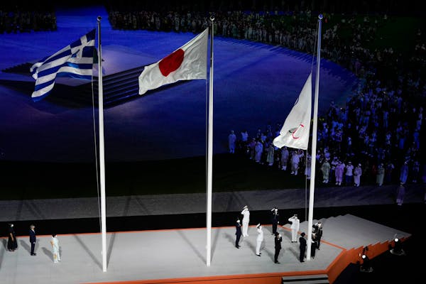 The Olympic flag is lowered during the Closing Ceremony as the Tokyo Summer Games came to an end.