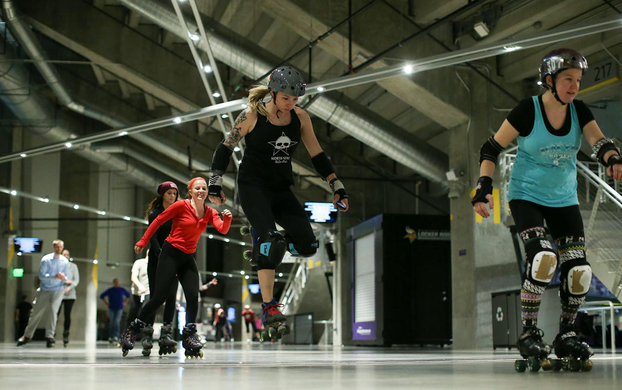 Dana Johnson of Dayton, who skates for the North Star Roller Girls as Val Kyrie, jumped over one of the expansion joints in the floor of the concourse. ] JEFF WHEELER ï jeff.wheeler@startribune.com Inline skating has begun in the concourse of U.S. Bank Stadium with more dates added through March 2017 due to popular demand. Hundreds of people skated during the family period from 5- 7 p.m. Tuesday night, December 27, 2016.