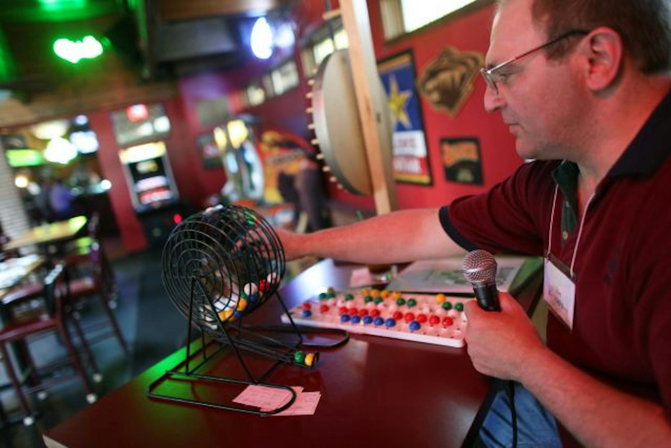 Jim McPherson read of letter and number combinations for 'Bango' at Paddy Wagon's Irish Sports Pub in Coon Rapids Thursday night.