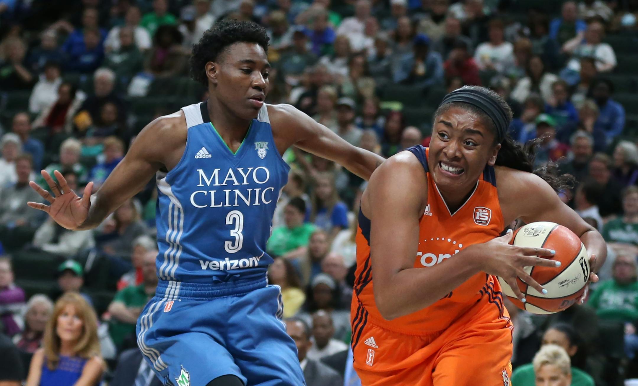 Connecticut Sun forward Morgan Tuck (33) drove to the basket on Minnesota Lynx forward Natasha Howard (3) at Xcel Energy Center May 22, 2017 in St. Paul, MN.