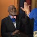 Justice Alan Page high fives students after the rhino hula hoop toss contest.