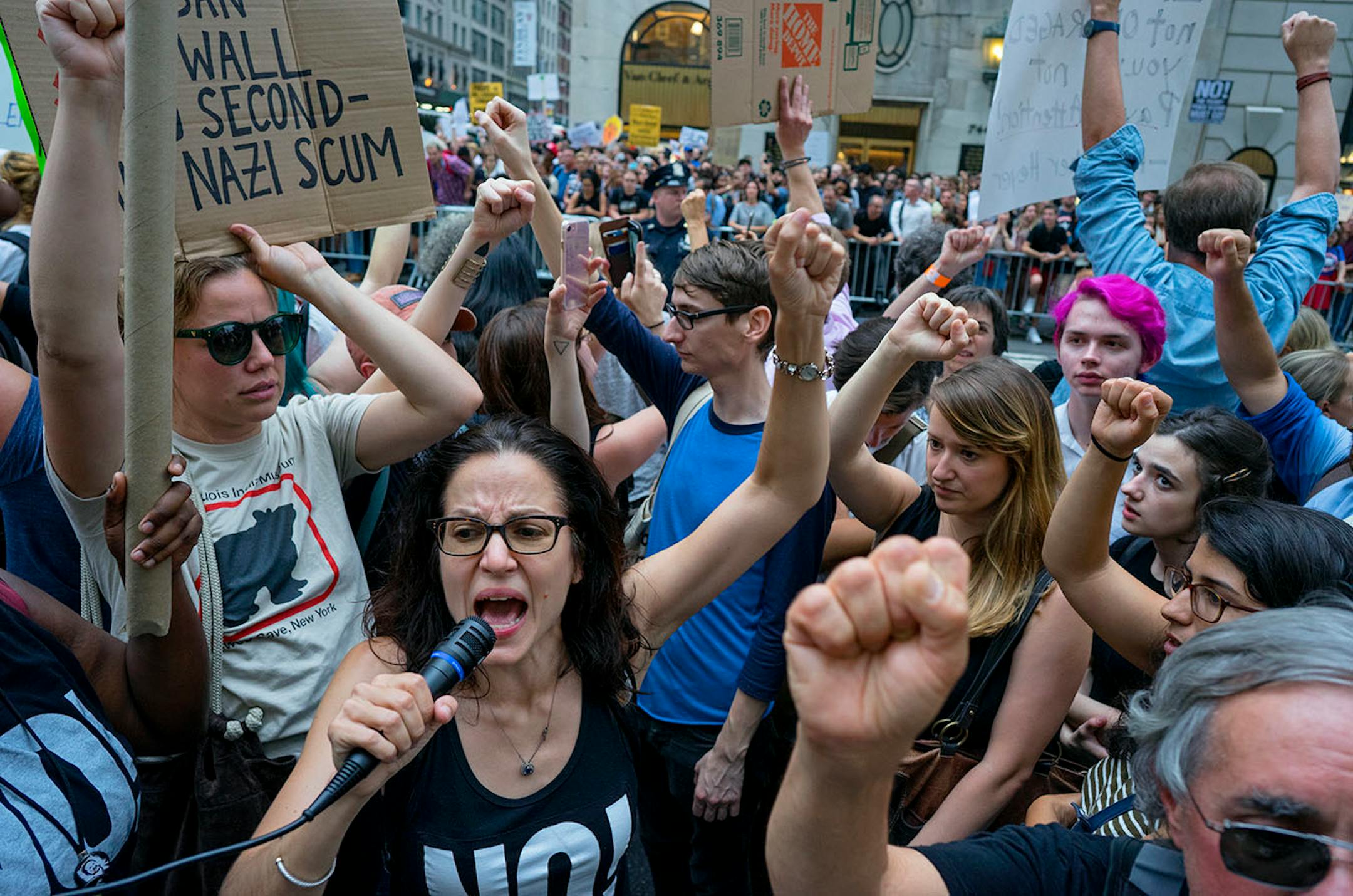Protestors gather near Trump Tower in New York, Monday, Aug. 14, 2017. Thousands of protesters and heavy security were ready to greet President Donald Trump as he headed for his home in the city on Monday for the first time since his inauguration.