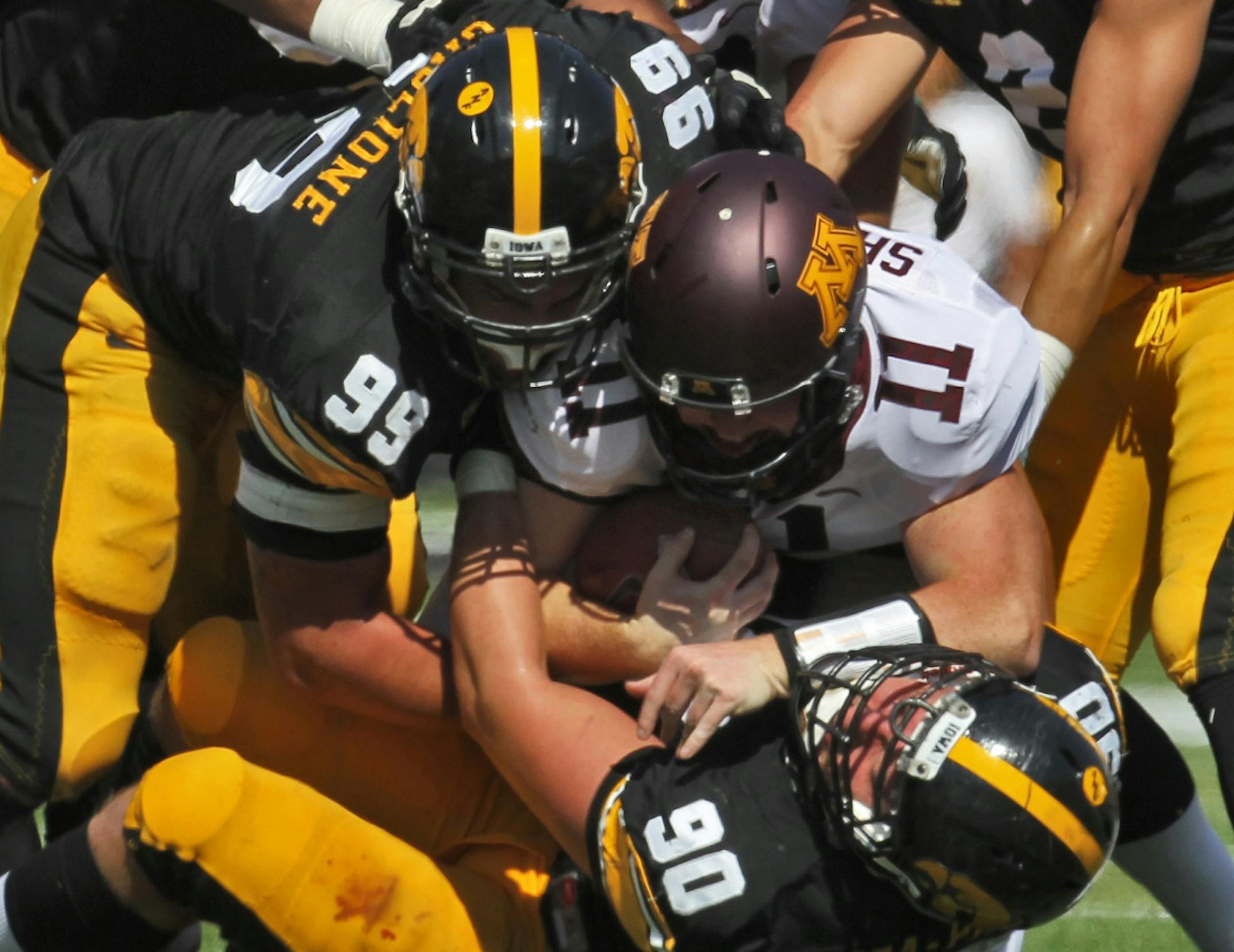 Quarterback Max Shortell was brought down by a mob of Iowa tacklers Saturday in the second half of the Gophers' 31-13 loss. With MarQueis Gray hurt, Shortell hasn't gotten much rest.
