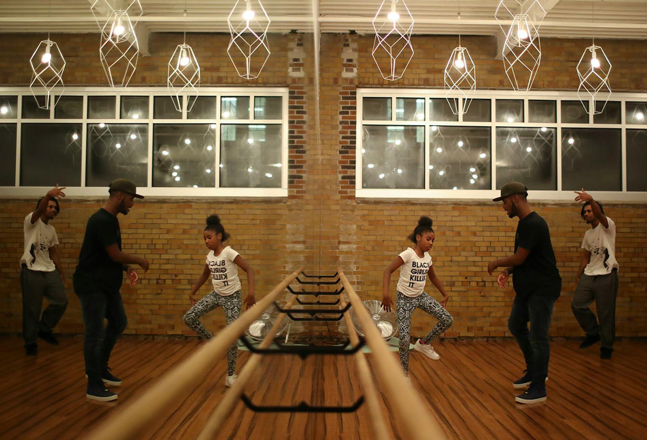 Herbert "Jus Herb" Johnson worked one-on-one with his niece, Vhlincia Love, 9, during the jam session as Michael Ingram observed.