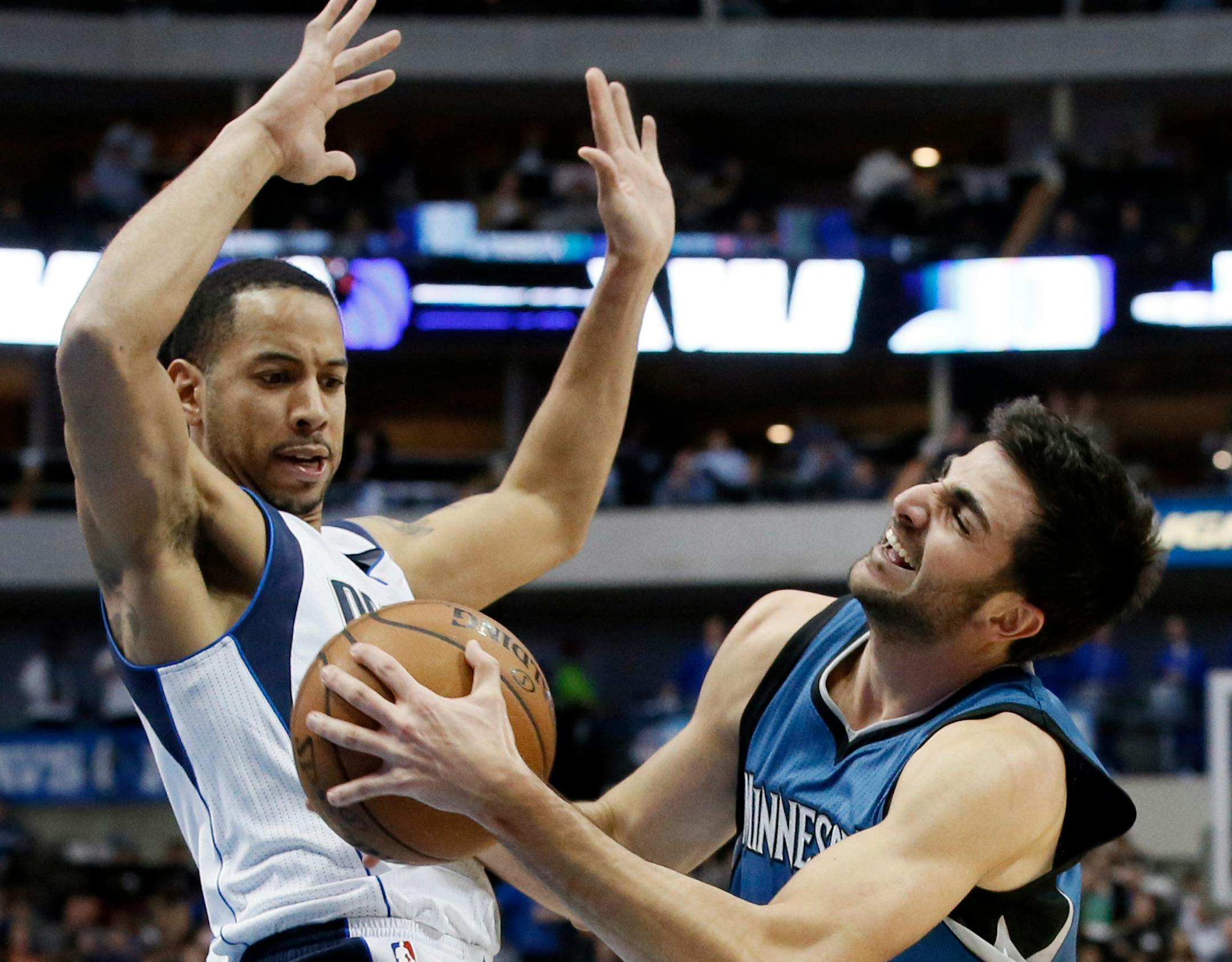 Wolves guard Ricky Rubio, right, collided with Mavericks guard Devin Harris during Monday's game in Dallas. Rubio scored 10 points in 21 minutes in his first game back after missing 42. The Mavericks won 100-94