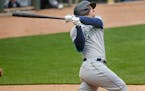 Seattle Mariners' Kyle Seager hits a three-run home run against the Minnesota Twins in the ninth inning of a baseball game Sunday, April 11, 2021, in 