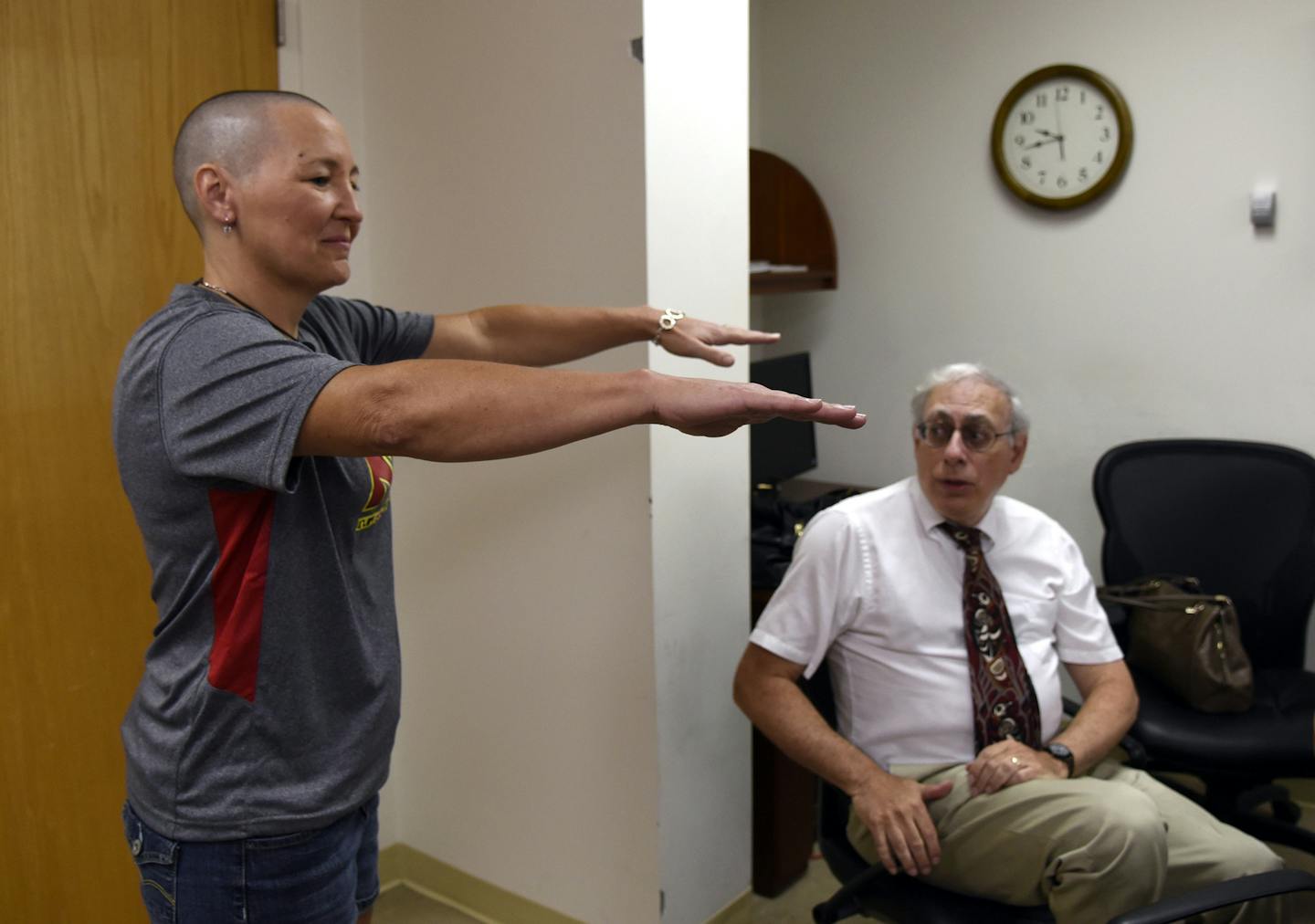 Kimberly Spletter has a follow-up appointment with neurologist Dr. Paul Fishman at the University of Maryland Medical Center on Sept. 1, 2015 in Baltimore, Md. Last week, she had a new treatment for Parkinson's disease called "MR guided focused ultrasound." (Barbara Haddock Taylor/Baltimore Sun/TNS)