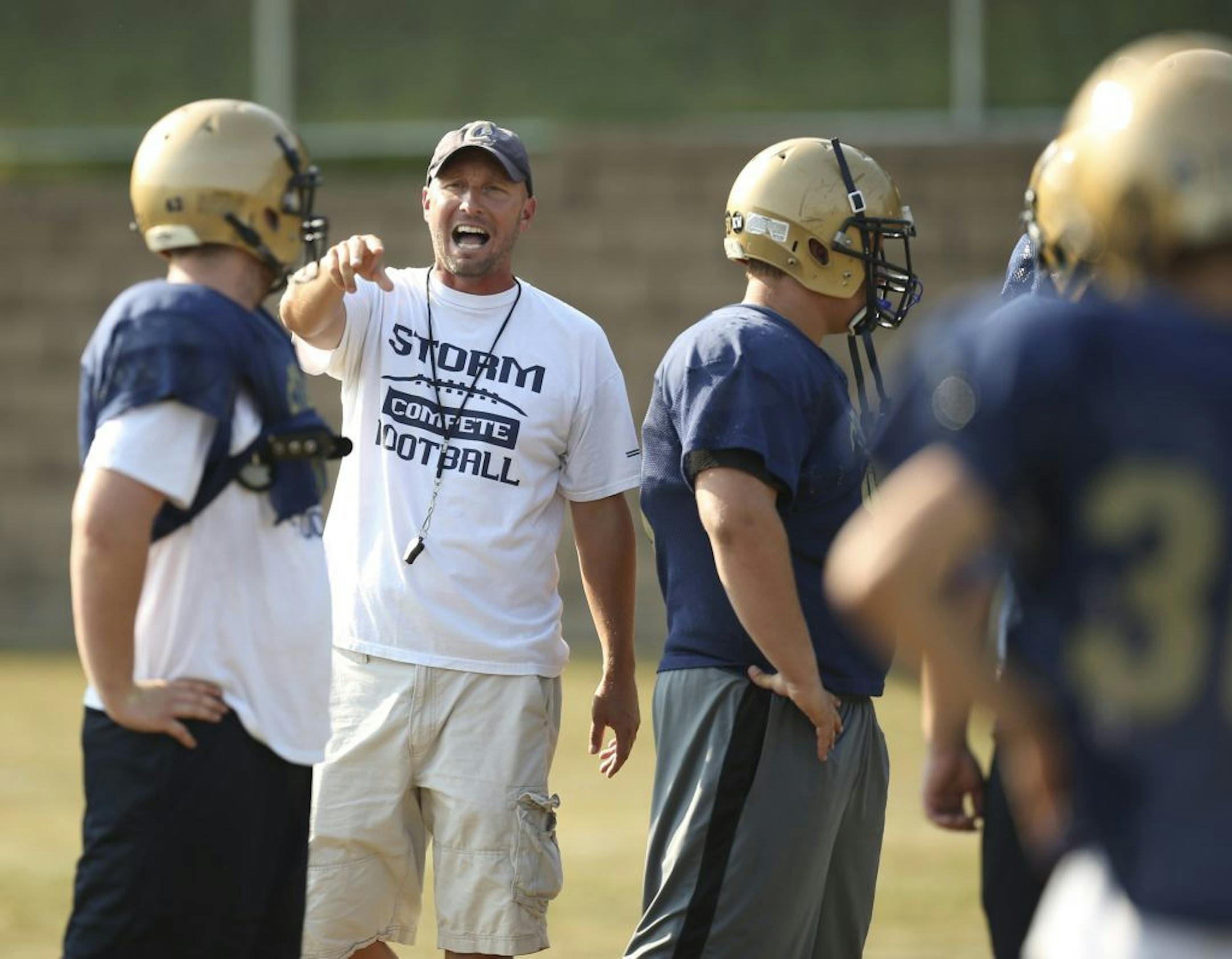 Head coach Bill Rosburg directed his team during Chanhassen's practice Thursday afternoon, September 5, 2013, on the eve of their game against Chaska.